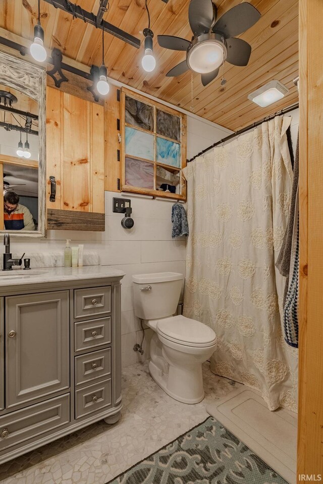 bathroom featuring wood ceiling, ceiling fan, vanity, and toilet