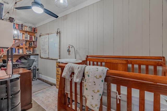 bedroom with wood walls