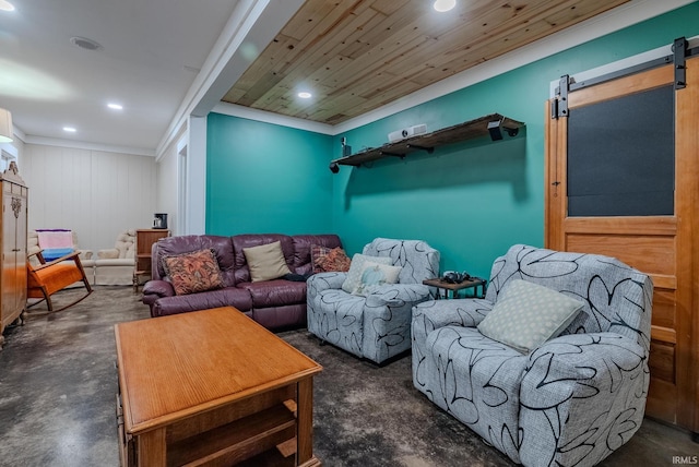 living room featuring a barn door and wooden walls