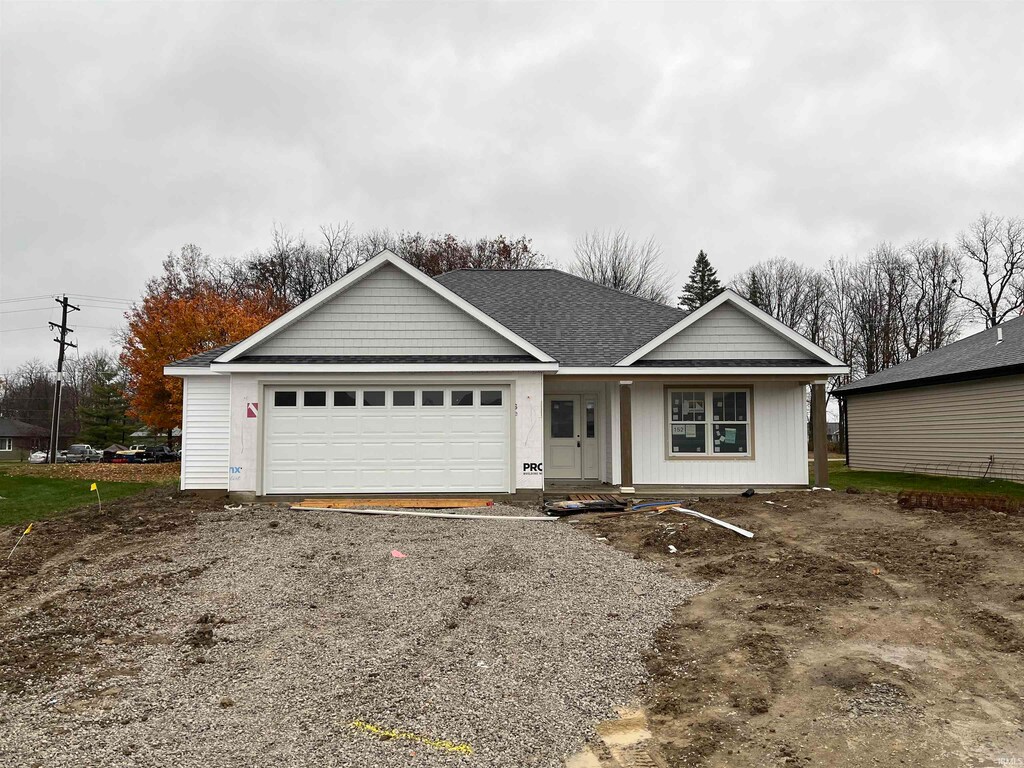 single story home featuring a garage
