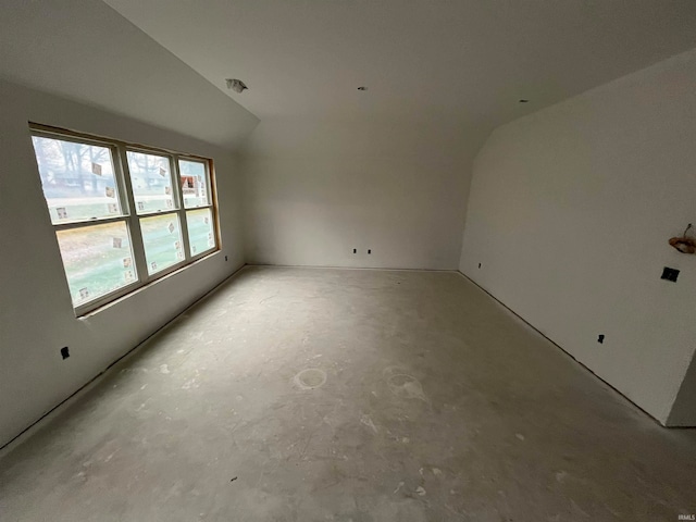 empty room with vaulted ceiling