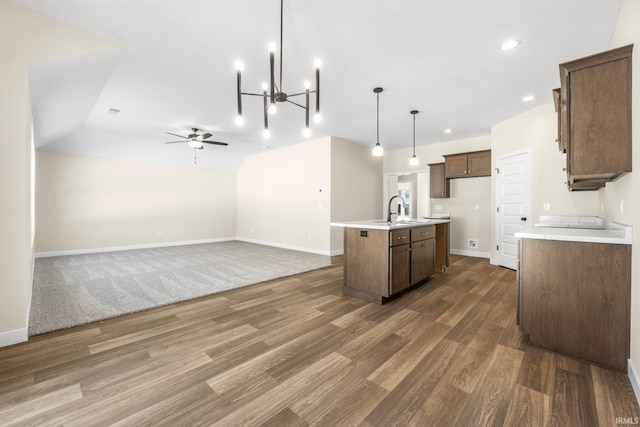 10209 Buckshire Ct, New Haven, IN 46774 - kitchen with a sink, a ceiling fan, wood finished floors, light countertops, and baseboards