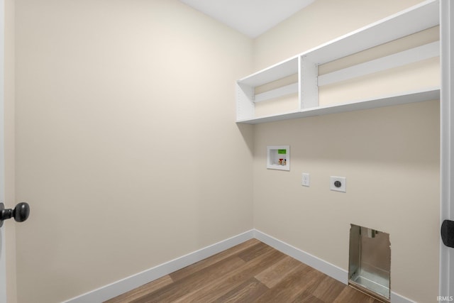 clothes washing area with hardwood / wood-style flooring, electric dryer hookup, and hookup for a washing machine