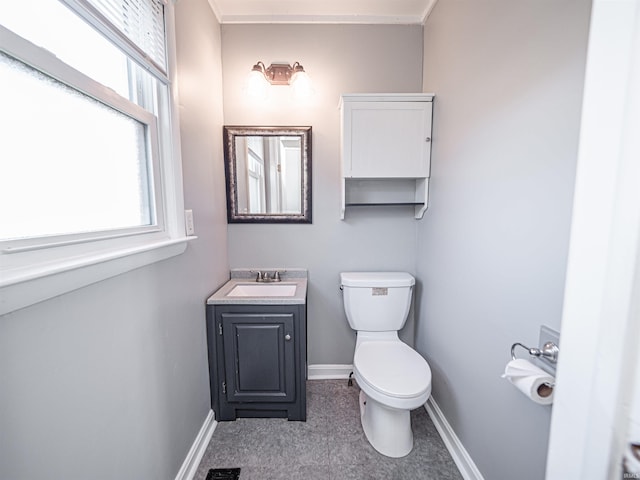 bathroom featuring vanity and toilet