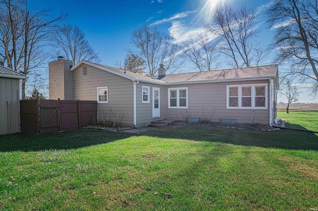 back of house with a yard