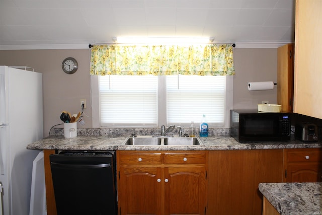 kitchen featuring black appliances, crown molding, and sink