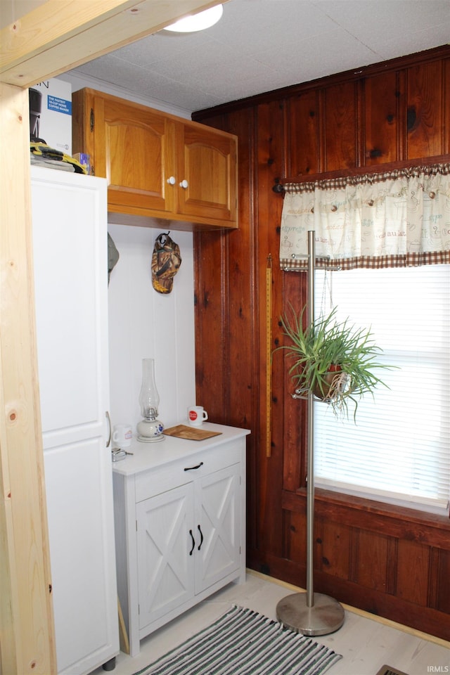 interior space featuring wooden walls