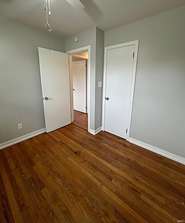 unfurnished bedroom with wood-type flooring and ceiling fan