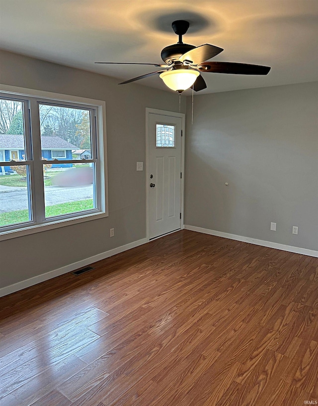 foyer featuring ceiling fan and wood-type flooring