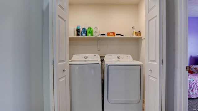 laundry room with independent washer and dryer