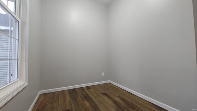 unfurnished room featuring hardwood / wood-style flooring and a wealth of natural light