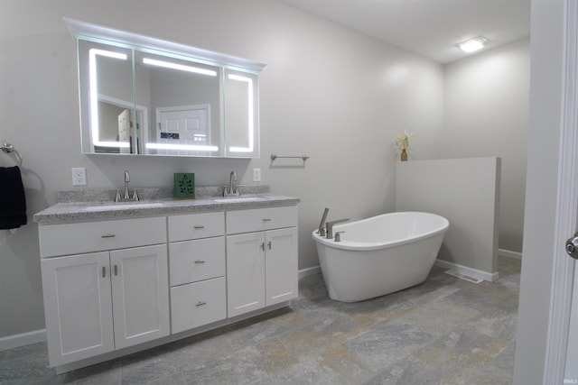 bathroom featuring a bathtub and vanity