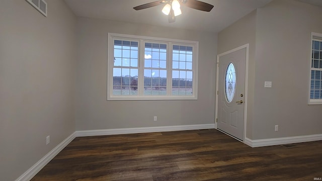 foyer with plenty of natural light, dark wood-type flooring, and ceiling fan