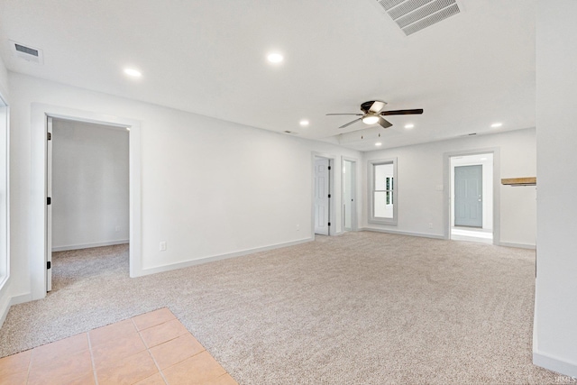 carpeted empty room with ceiling fan