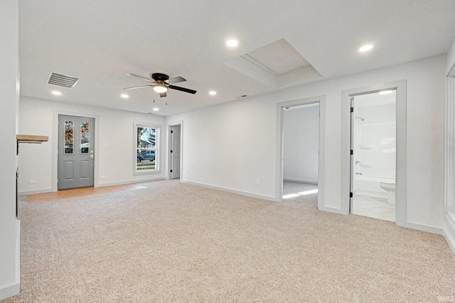 unfurnished room featuring ceiling fan and light colored carpet