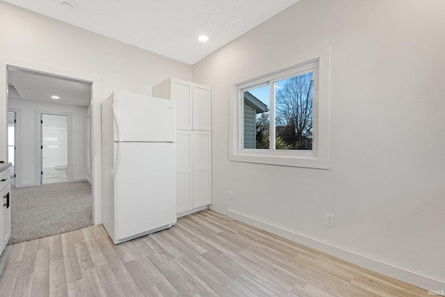 empty room with light hardwood / wood-style floors