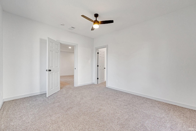 unfurnished bedroom with ceiling fan and light carpet