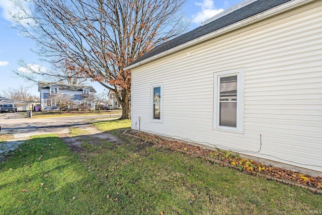 view of property exterior with a yard