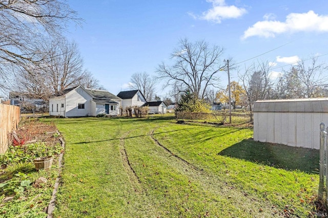 view of yard featuring a storage unit