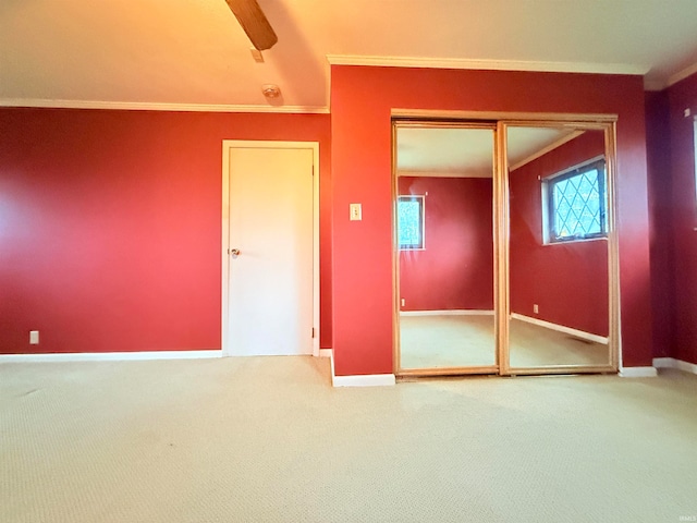 unfurnished bedroom with a closet, multiple windows, and ceiling fan