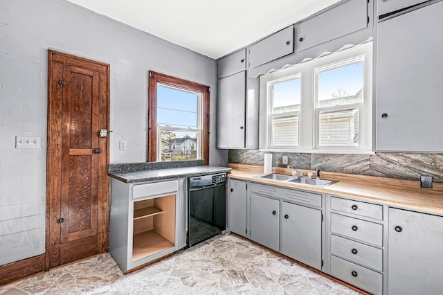 kitchen with gray cabinetry, dishwasher, a healthy amount of sunlight, and sink