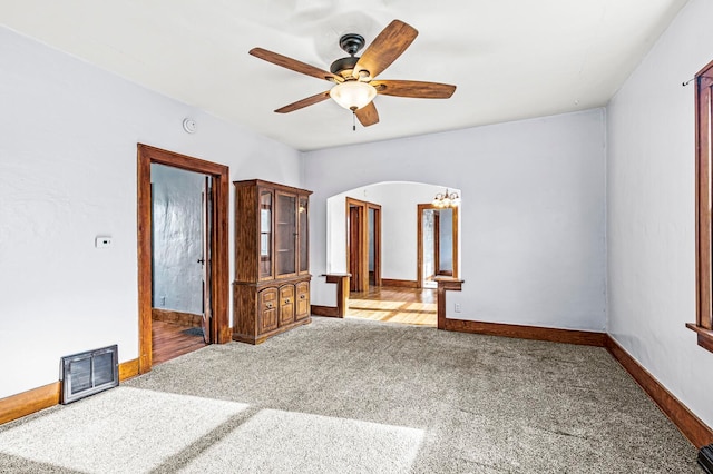 unfurnished bedroom with ceiling fan and carpet