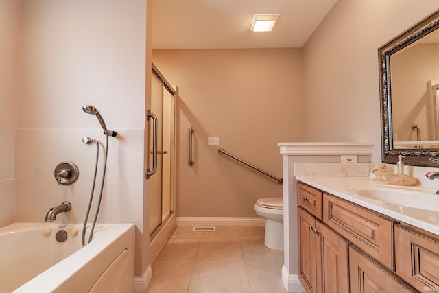 bathroom with tile patterned floors, vanity, and toilet