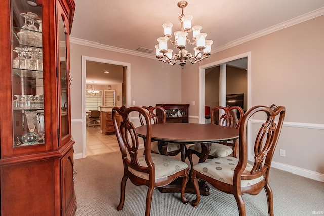 carpeted dining space featuring a chandelier and ornamental molding