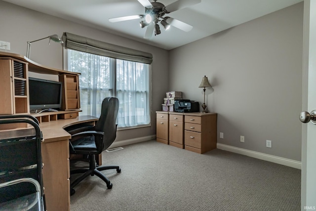 home office featuring light colored carpet and ceiling fan