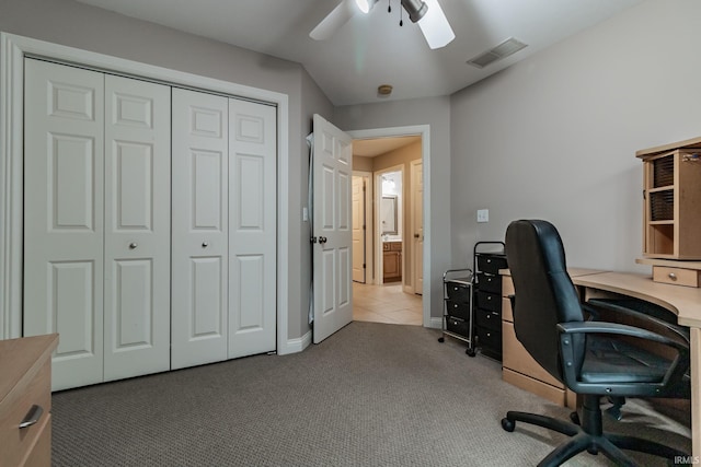 carpeted home office with ceiling fan