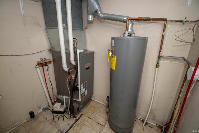 utility room featuring gas water heater