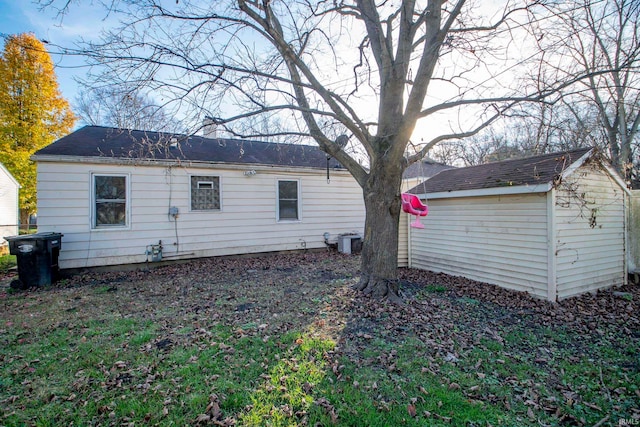 rear view of house featuring central AC