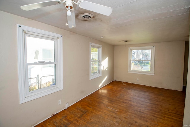 unfurnished room with hardwood / wood-style floors and ceiling fan