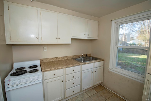 kitchen with sink, white cabinetry, white electric stove, and light tile patterned floors