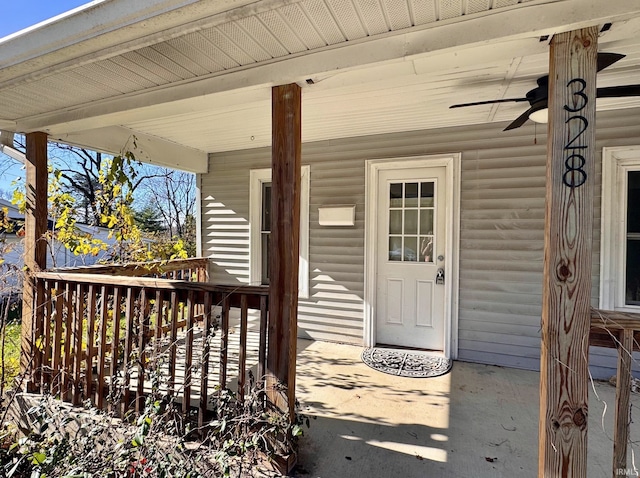 view of exterior entry with ceiling fan