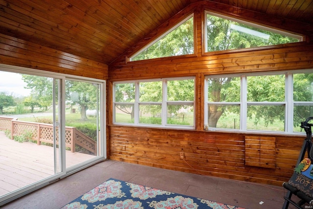 sunroom / solarium featuring vaulted ceiling and wood ceiling