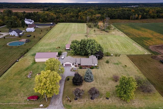 aerial view at dusk featuring a rural view