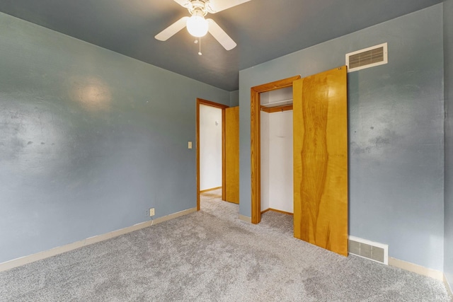 unfurnished bedroom featuring light colored carpet and ceiling fan