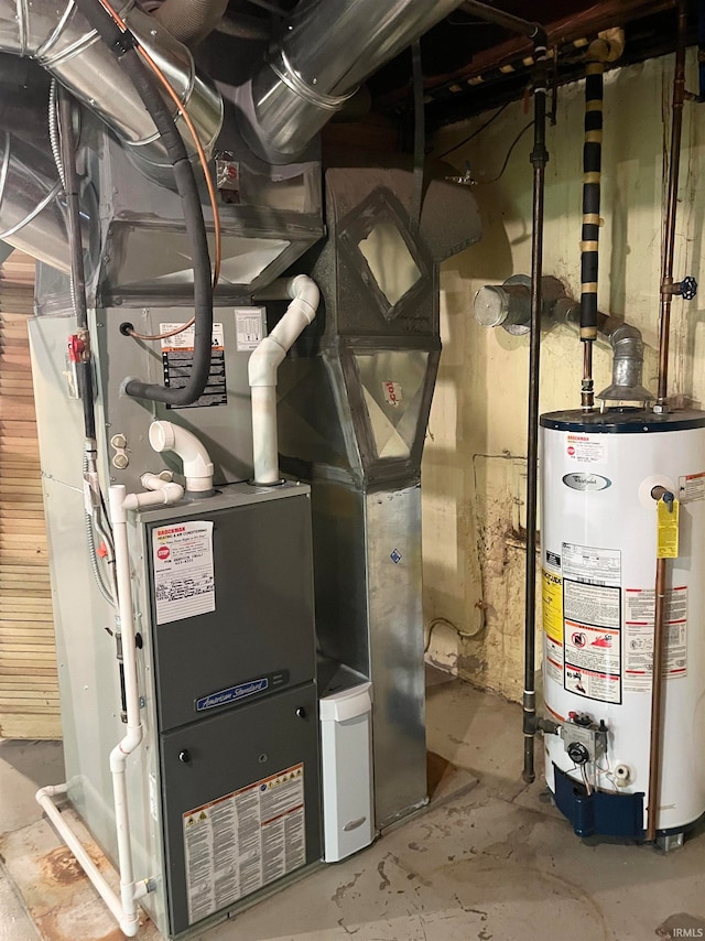 utility room with gas water heater