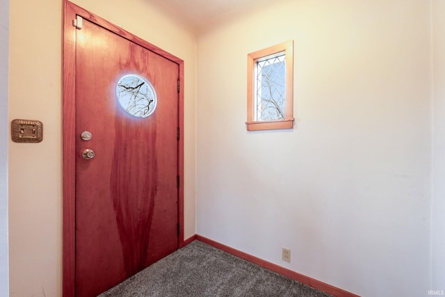 foyer entrance with carpet floors