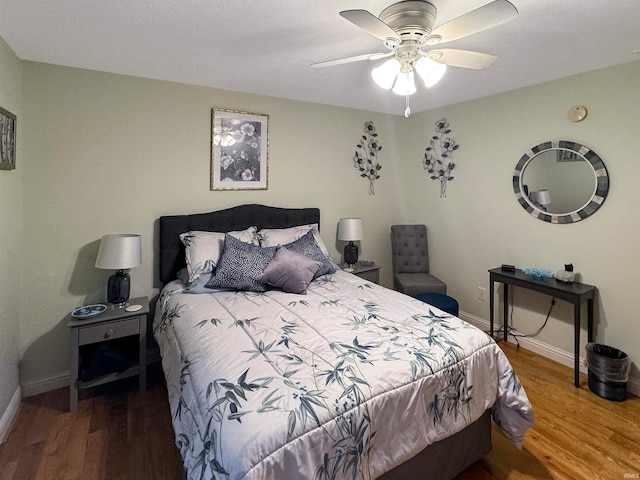 bedroom featuring hardwood / wood-style flooring and ceiling fan