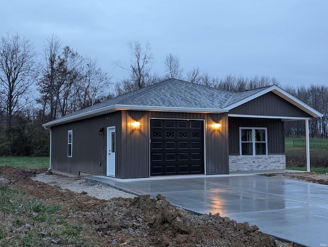 view of front facade with an outdoor structure and a garage