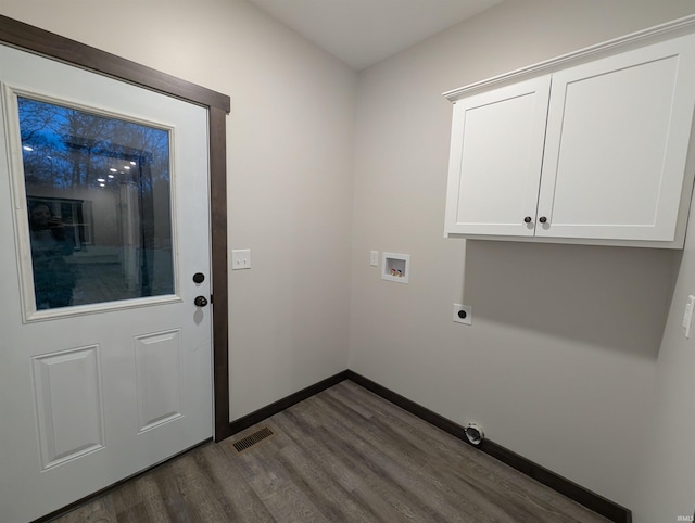 clothes washing area featuring hookup for an electric dryer, dark hardwood / wood-style flooring, cabinets, and washer hookup