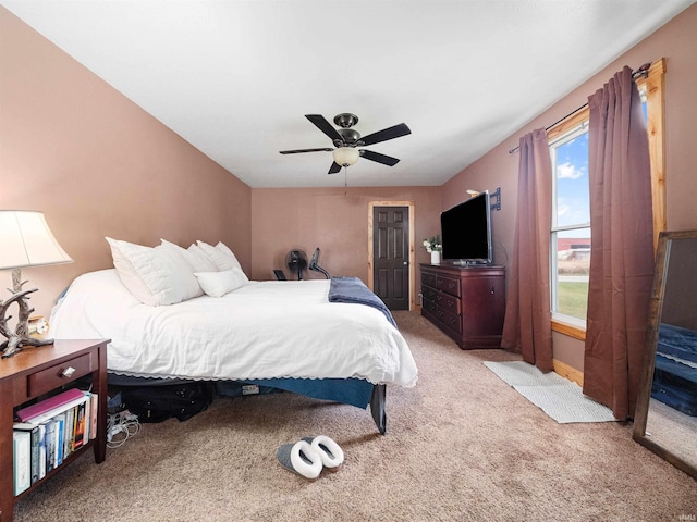 bedroom featuring ceiling fan and light carpet