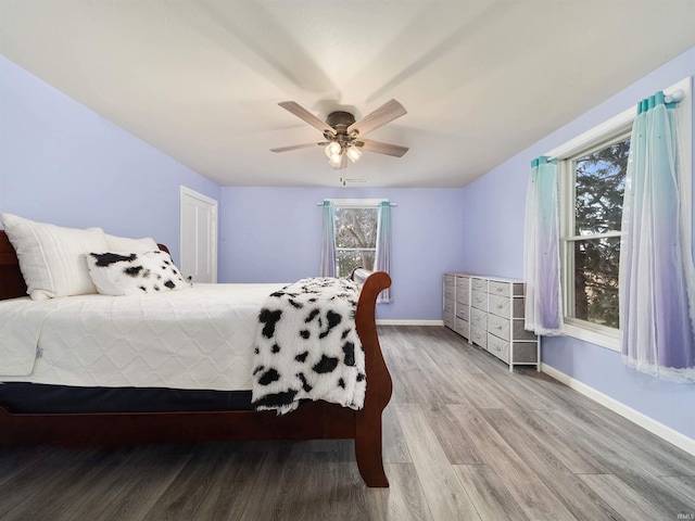 bedroom featuring hardwood / wood-style floors and ceiling fan