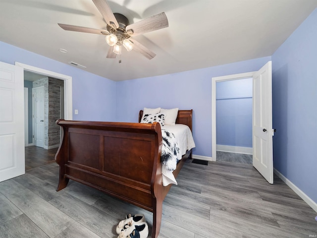 bedroom featuring hardwood / wood-style floors and ceiling fan