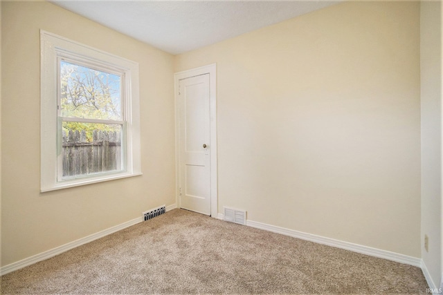 unfurnished room featuring carpet flooring