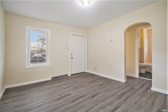 empty room featuring dark hardwood / wood-style floors