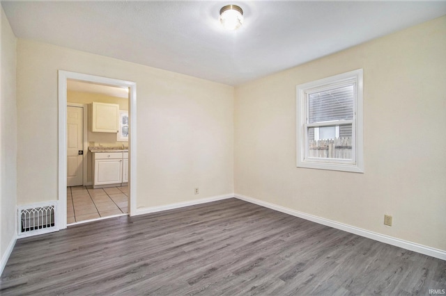 empty room featuring wood-type flooring