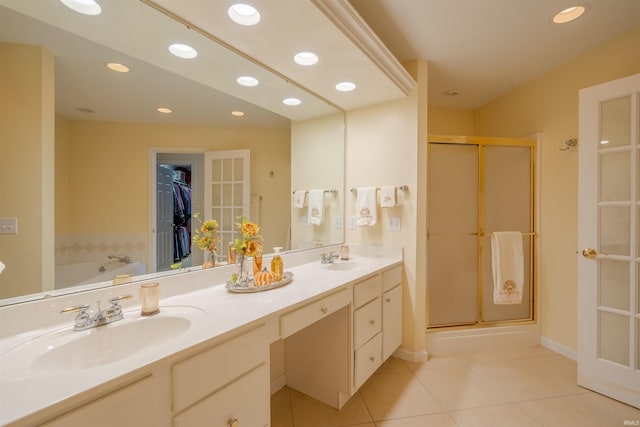 bathroom featuring tile patterned floors, vanity, and independent shower and bath